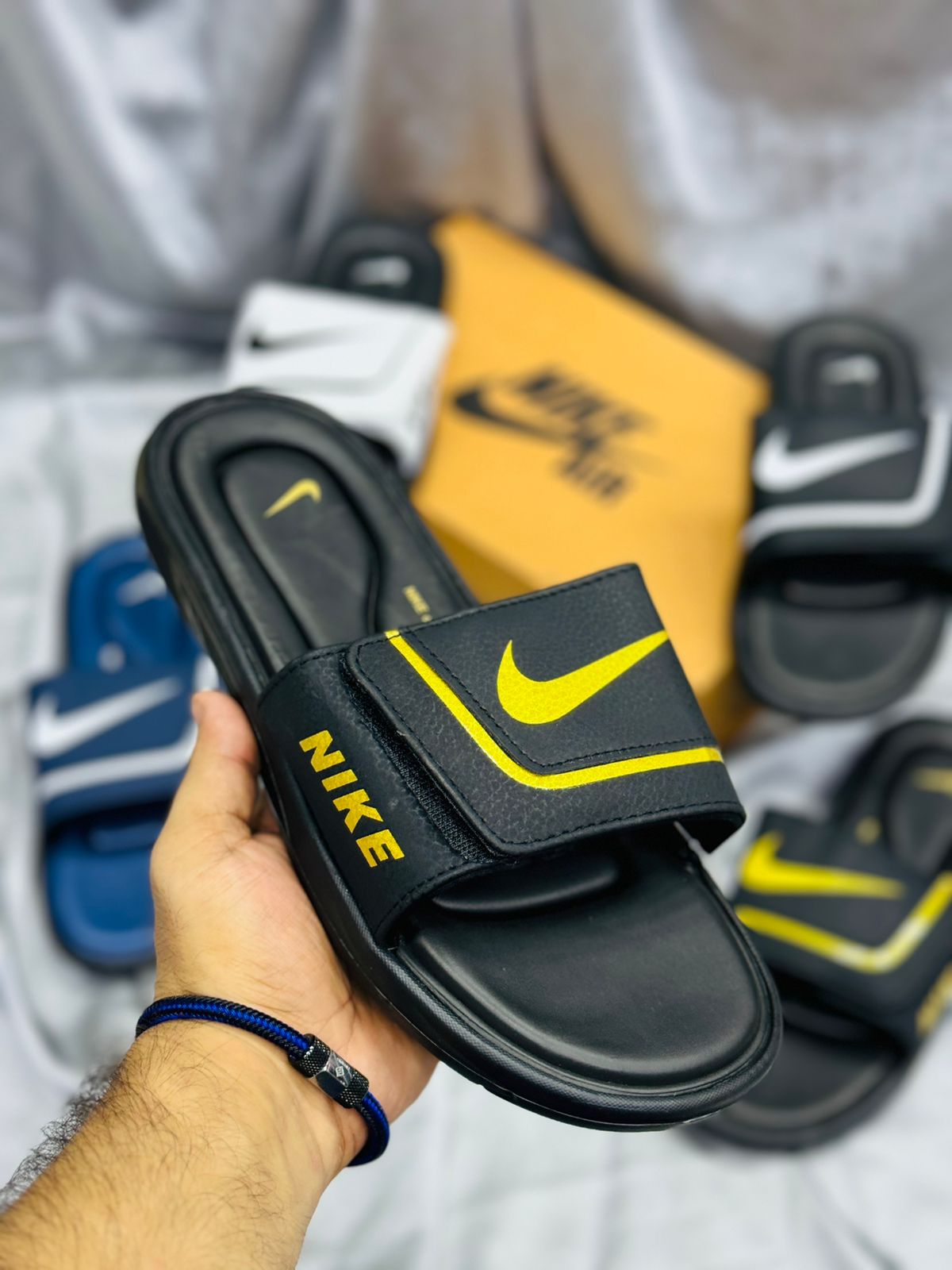 Black and gold nike sliders online